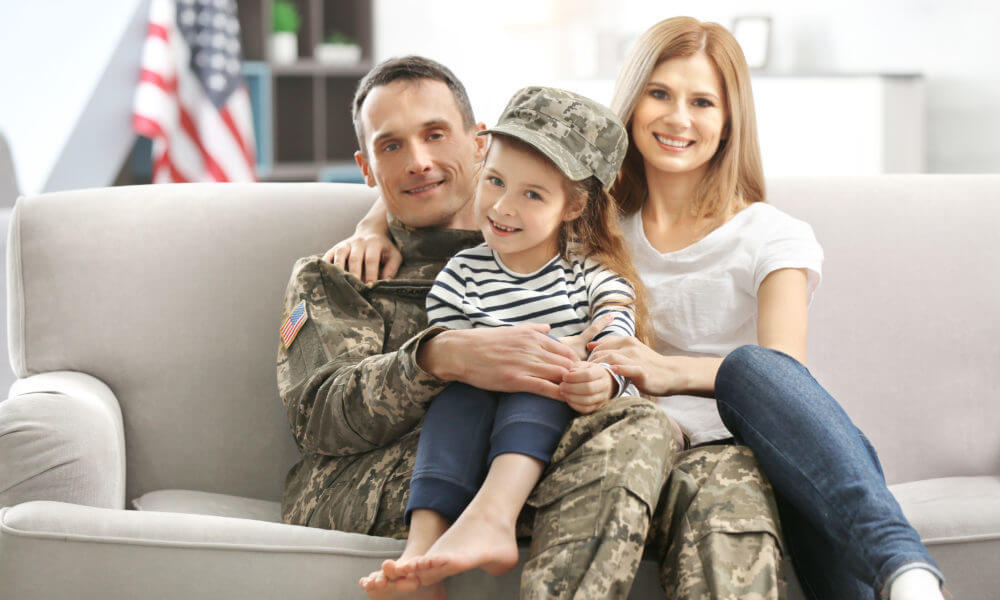 military family sitting on the couch