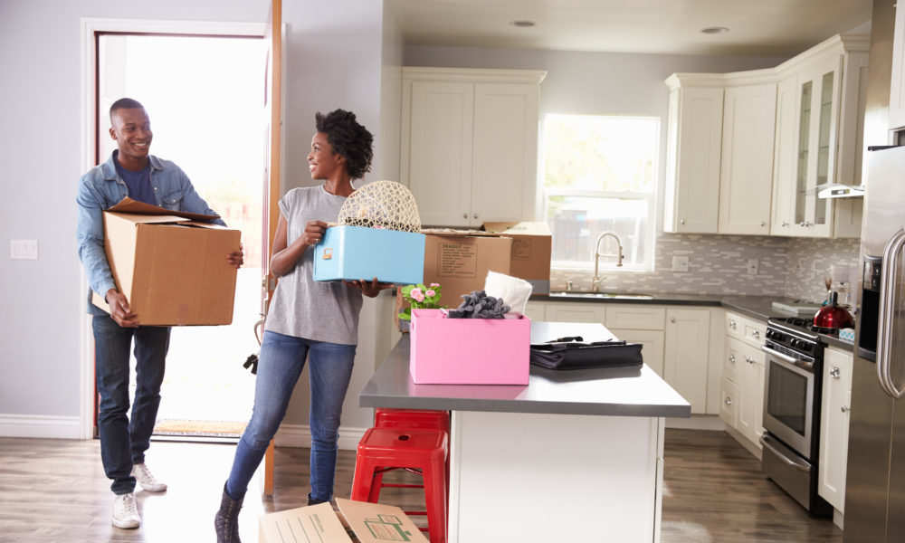 Young couple moving in to new home together