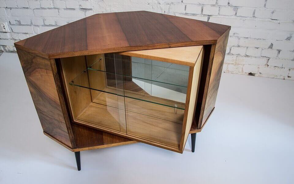 an image of a wooden cupboard with glass drawers
