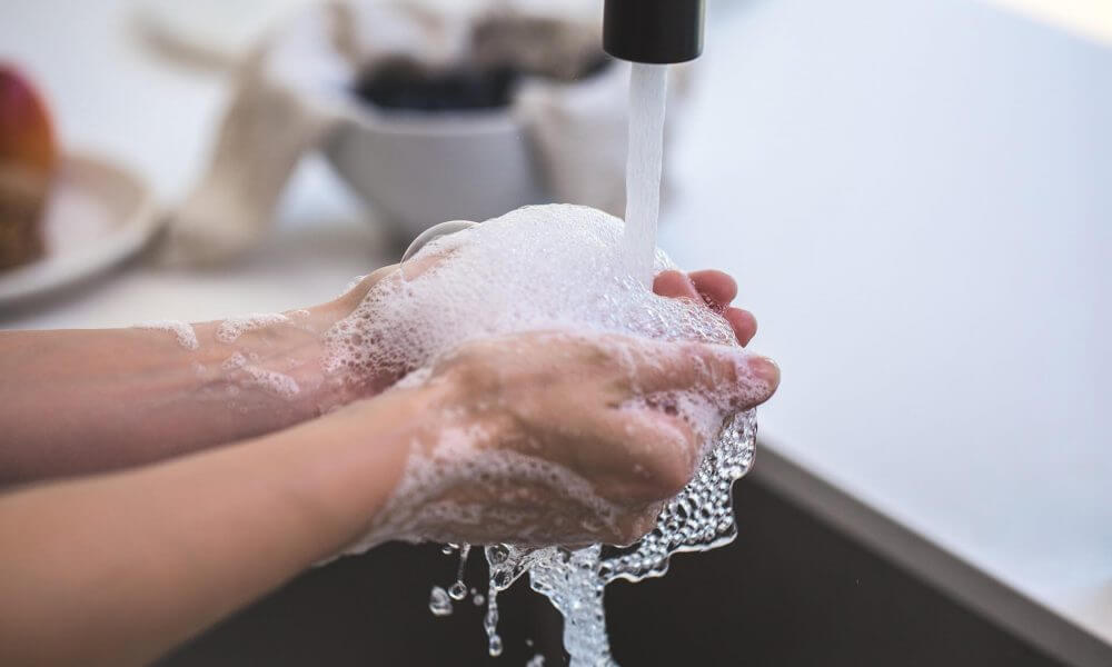 A person washing hands