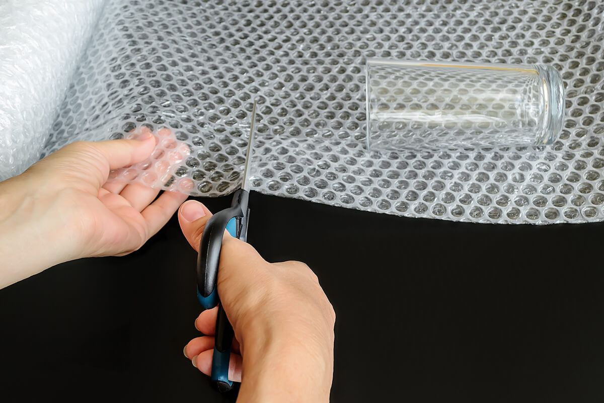 A glass placed on a sheet of bubble wrap