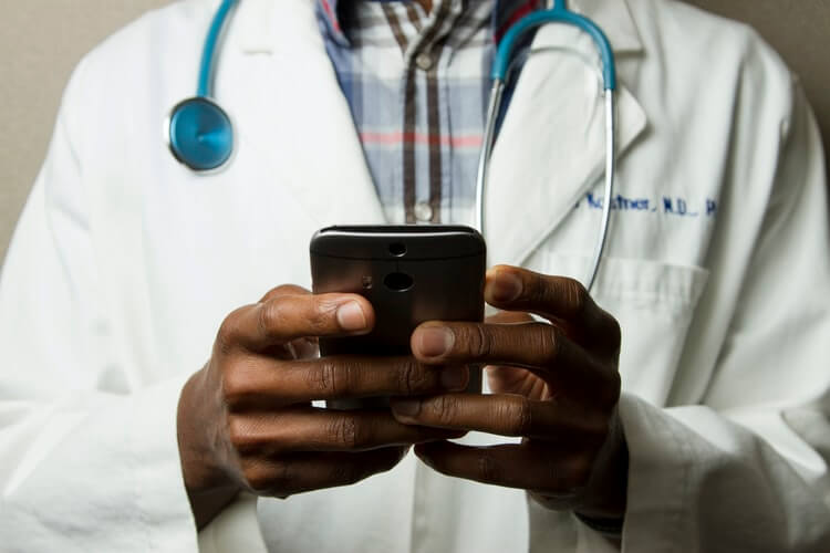 Medical worker holding a phone