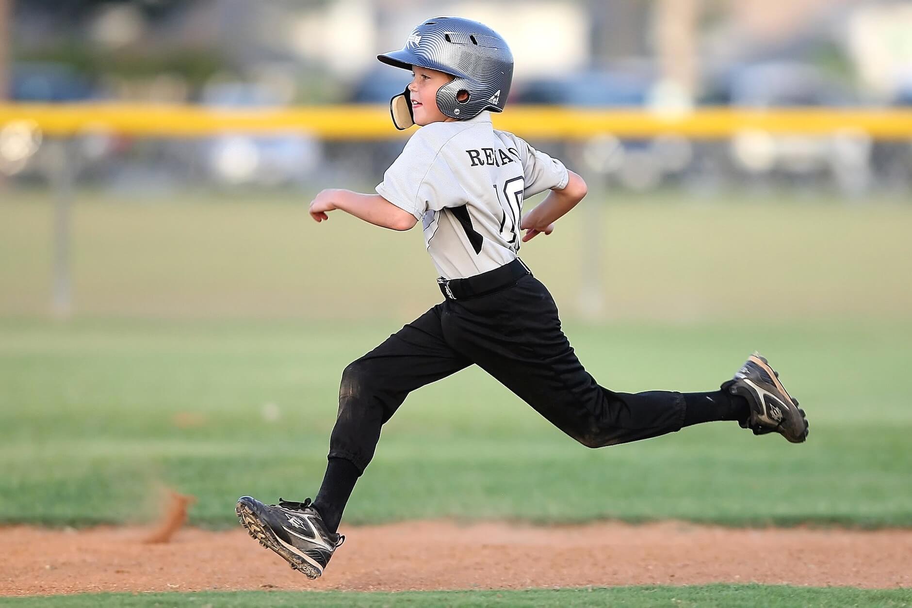 A kid playing football after long-distance moving