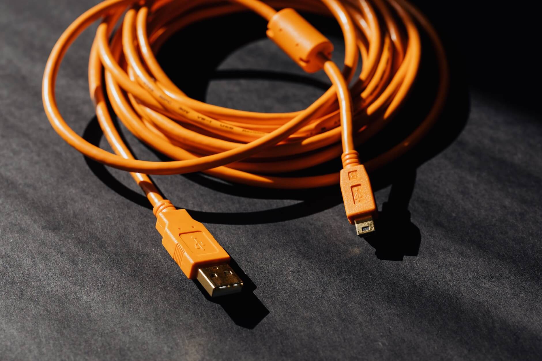 Orange USB cable getting ready to pack for cross-country moving services