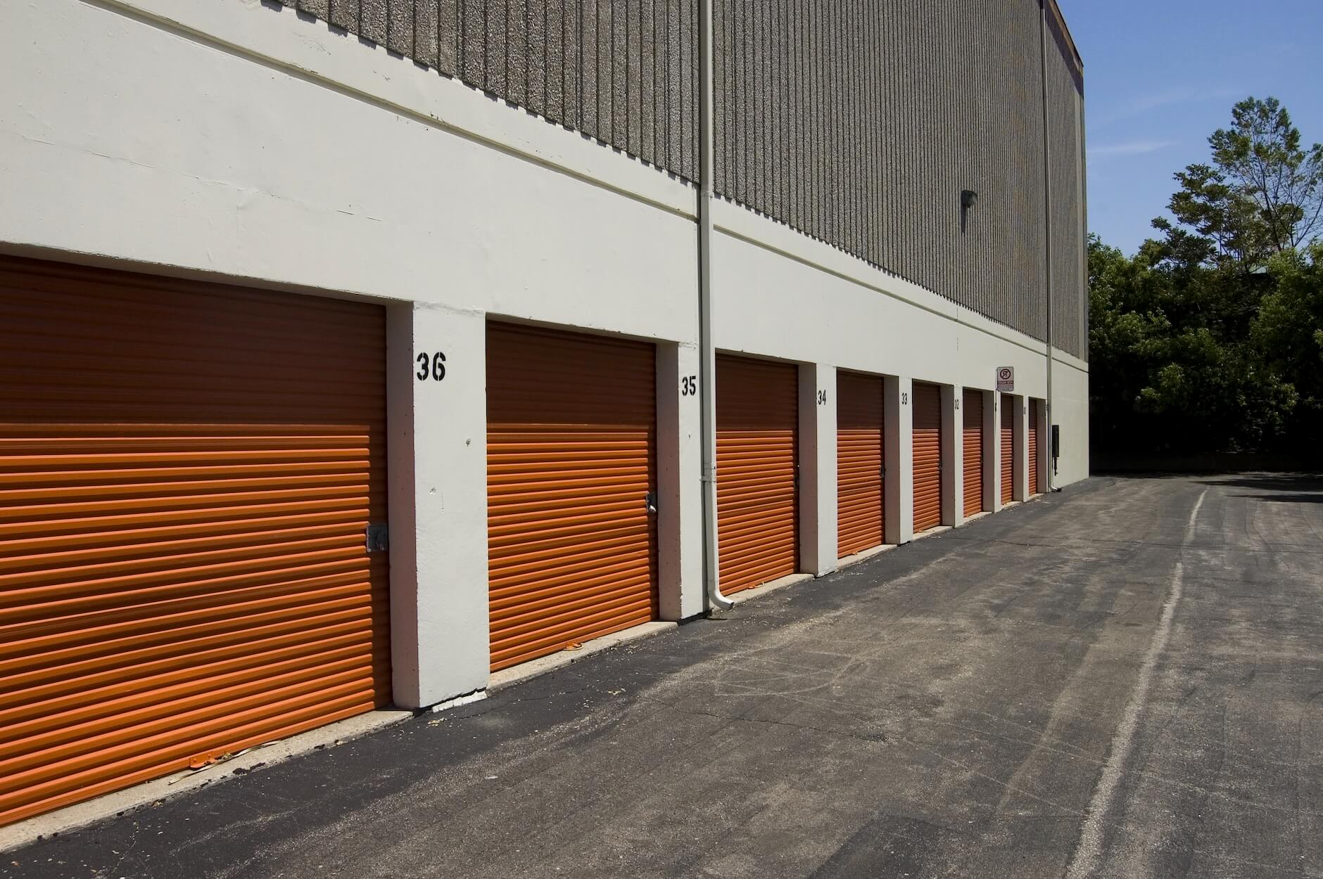 Storage units in a row with orange doors