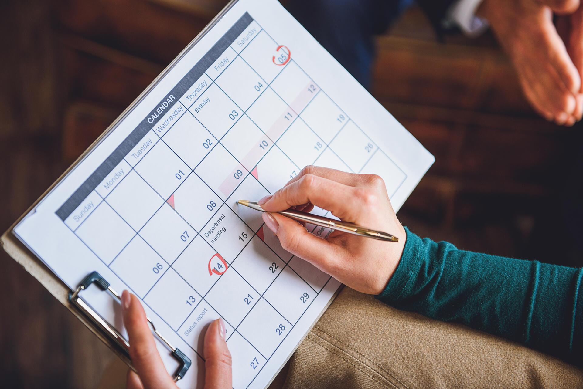 Person making a relocation schedule, calendar
